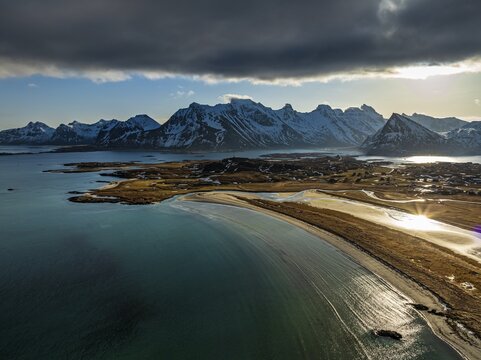 Aerial view of beach and mountains, coast, winter, sun, backlight, Moskenesoya, Lofoten, Norway