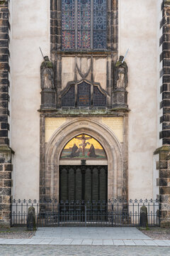 Door of the Castle Church in Wittenberg, Germany, featuring the 95 Theses by Martin Luther. Historic Reformation landmark and cultural heritage site.