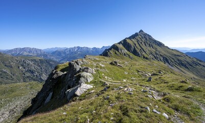 Hiking trail in idyllic mountain landscape, summit Steinkarspitz or Monte Antola, Carnic High Trail, Carnic Main Ridge, Carnic Alps, Carinthia, Austria