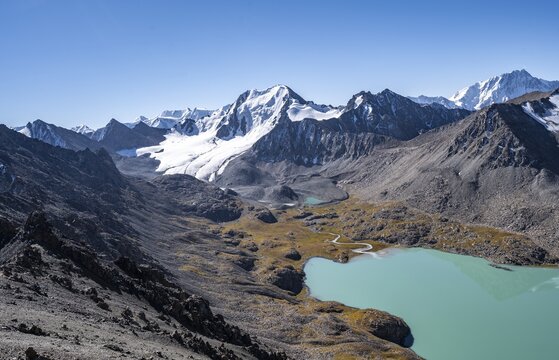 View of mountains and glaciers and turquoise Ala Kul mountain lake, Tien Shan Mountains, Kyrgyzstan