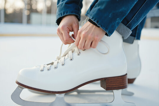 Figure Skating Preparation – White Leather Skates and Winter Outfit for Winter Sports Blogs, Lifestyle Magazines, and Recreational Activity Presentations
