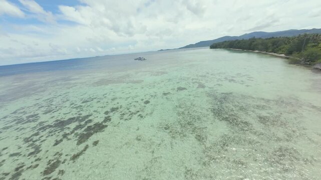 Dynamic FPV Drone Shot Soaring Over Pristine Tropical Beaches and Island Scenery of Karimunjawa