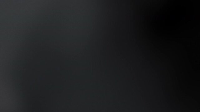 Dark blurry abstract background suitable for graphic design projects, website backgrounds, presentations, and artistic creations with a mysterious vibe.