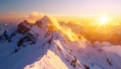 A breathtaking aerial view of snow-covered mountain ranges illuminated by a brilliant sunrise, creating a dramatic and serene landscape.