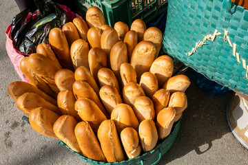El Jem, Tunisia A basket of fresh baguettes in the souk or Medina.