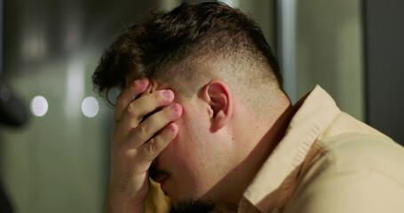 Angry manager shouting during tense business meeting in modern office with analytics presentation in background, scolding employee, workplace conflict and leadership stress