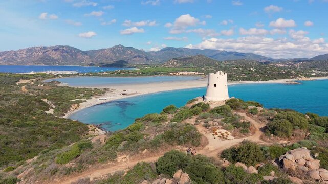 scenic view of historic tower and coast, panoramic image of old tower overlooking turquoise waters