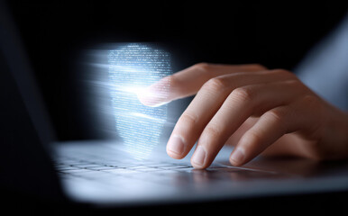 Focused close up of hand touching digital fingerprint for biometrics security. Advanced technology for identity access, login authentication, and data protection on laptop