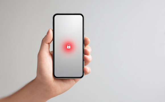 Hand holding phone with red lock icon symbolizing security threat. cybersecurity concept represents data protection, privacy issues, and denied access to system