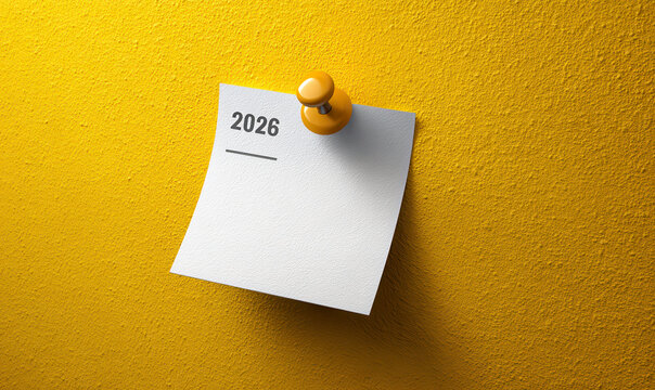 The year 2026 is affixed to a textured wall with a yellow push pin.