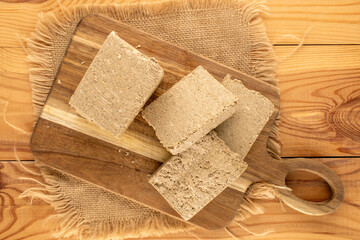 Fragrant sweet halva on the table, top view, macro.