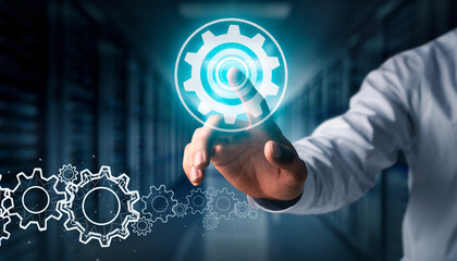 Man's hand interacting with glowing digital settings gear icon in a server room.