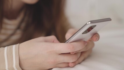 hands send typed text in a chat in a smartphone, work on the Internet on the phone online,...