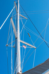 Fototapeta premium Mast on a catamaran against a blue sky