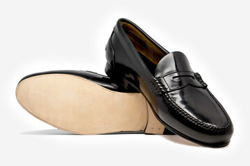 Classic leather shoes in a white background. Black moccasins