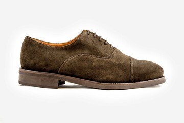 Classic leather shoes in a white background.  Classic brown suede shoe with texture.