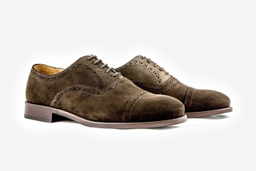 Classic leather shoes in a white background.  Classic brown suede shoe with texture.