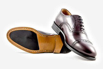 Classic leather shoes in a white background. 