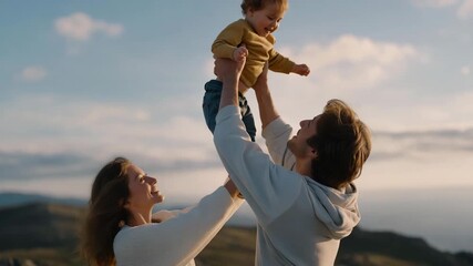 Veteran lifting child into the air while spouse sets up picnic — representing love, family connection, parenthood, gratitude, and rebuilding happiness through simple moments together. cinematic