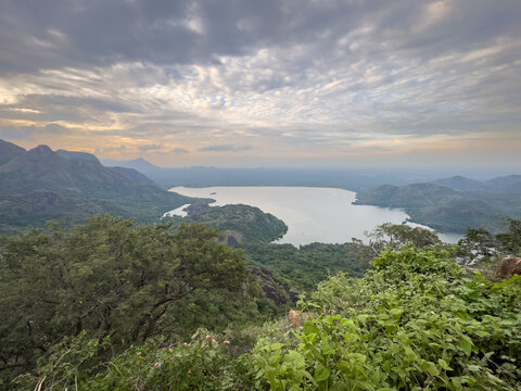 Panoramic view of Aliyar Dam reservoir from Loam's View Point en route to Valparai, surrounded by lush green mountains in Coimbatore district, Tamil Nadu.