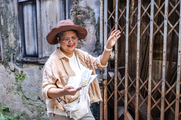 Senior travel tourist adventure use old school way of navigation street urban exploration, elderly lifestyle, healthcare, retirement female enjoy leisure walking exercise, health insurance, wellbeing