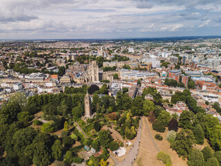Bristol UK: 28th July 2025: Breathtaking drone view of Cabot Tower surrounded by lush greenery of Brandon Hill park. With University of Law in background