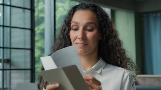 Sad Hispanic business woman opening letter bad news open paper envelope reading reject bank deny Arabian ethnic businesswoman female girl read stressed information work faired unemployment upset lady