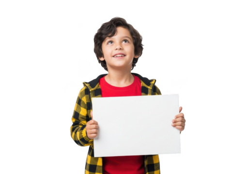 Joyful young boy with curly dark hair wearing a red shirt and yellow plaid jacket holding a blank white sign isolated on transparent background