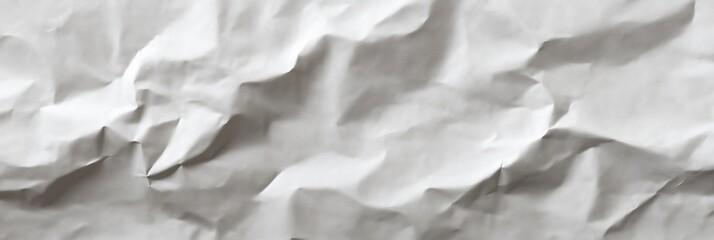 Obraz premium Crumpled white paper texture with creases and shadows