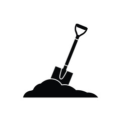 Black silhouette of a shovel digging into a pile of dirt © ariyan