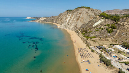 Aerial view of the beach and coastline of Siculiana Marina, in province of Agrigento, Sicily, Italy. It is a long sandy coast overlooking the Mediterranean Sea, whose waters are blue and turquoise.