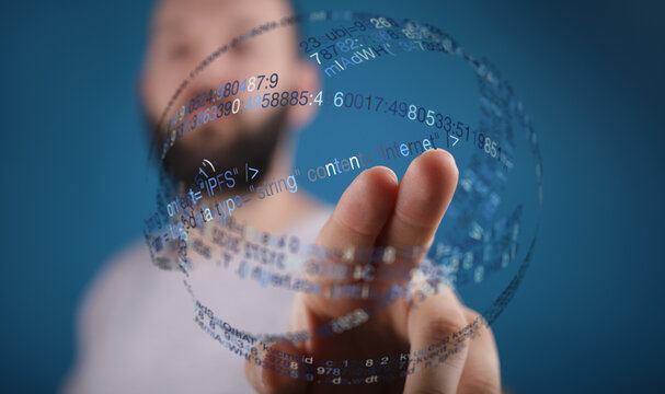 Abstract image showing a hand interacting with digital data, representing technology, communication and connectivity. Perfect for tec