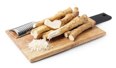 Grated horseradish, grater and roots isolated on white