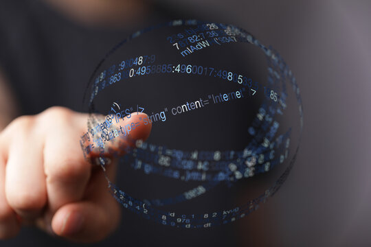 Close-up of a hand touching a digital globe with binary code, symbolizing technology, innovation, and network connection. Ideal for d