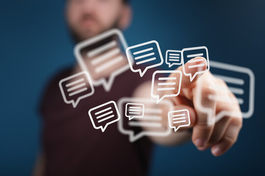 Close up of a hand interacting with floating message bubbles representing online messaging and social media communication.
