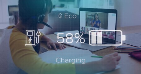 Writing girl in yellow top headset leaning at home table, laptop showing call 58% charging overlay