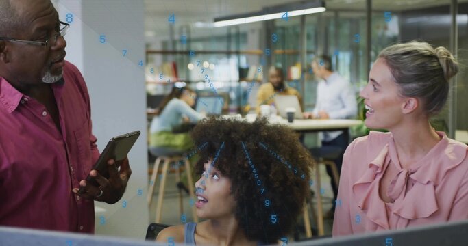 Listening woman with curls wearing sleeveless top looking up at man holding tablet in open office - Powered by Adobe