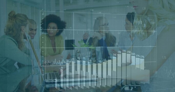 Discussing team in suits collaborating at meeting table, with laptops and charts overlay