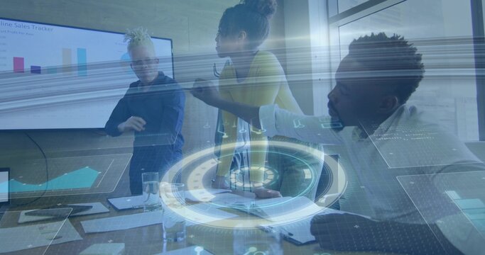 Pointing mid-adult woman in skirt and blouse leaning over conference table, showing holographic UI - Powered by Adobe