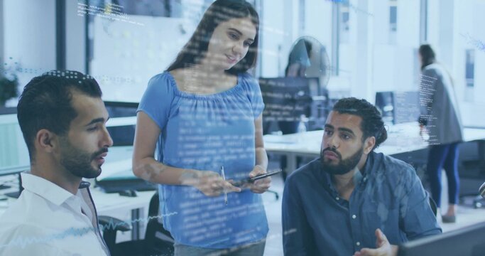 Explaining woman in blue blouse pointing to tablet between two seated men in office, code overlay