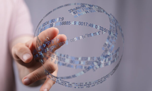 An artistic image of a hand holding a data sphere with digital code flowing around. Perfect for technology, internet, and data-relate