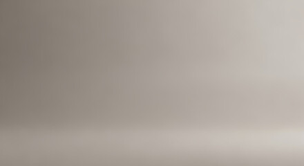 A neutral, soft studio background with subtle lighting and a hint of shadow