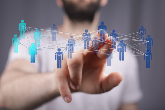 Hand touching digital network of people. Modern concept of communication, connection, technology and social media. Global community and teamwork