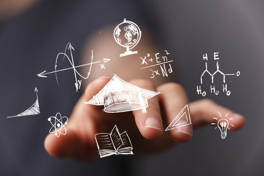 A hand interacts with floating digital icons representing education, science, and innovation, symbolizing future learning and knowledge acquisit