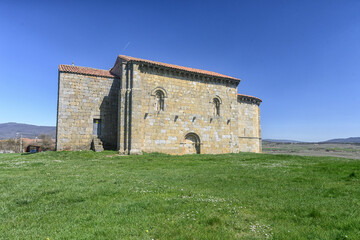 Obraz premium Romanesque stone church of San Martin in Matalbaniega under a bright sky