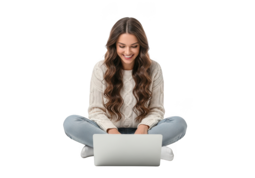 Young woman with long wavy hair smiling while sitting cross legged using a laptop computer isolated on transparent background