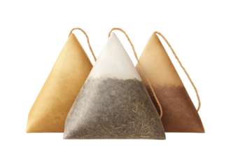 Three pyramid tea bags with strings isolated on a transparent background