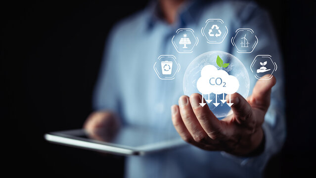 Digital concept showing CO2 reduction, clean energy icons, and sustainable technology, highlighting eco-friendly innovation, carbon footprint management, and environmental responsibility.