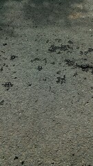 Close-up of rough asphalt surface texture background