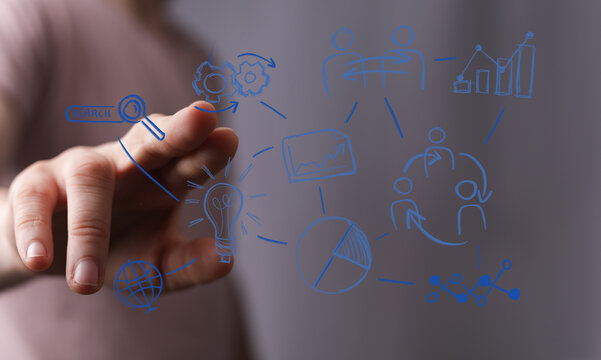 Hand pointing at digital business plan icons. Ideas, teamwork, growth, success.